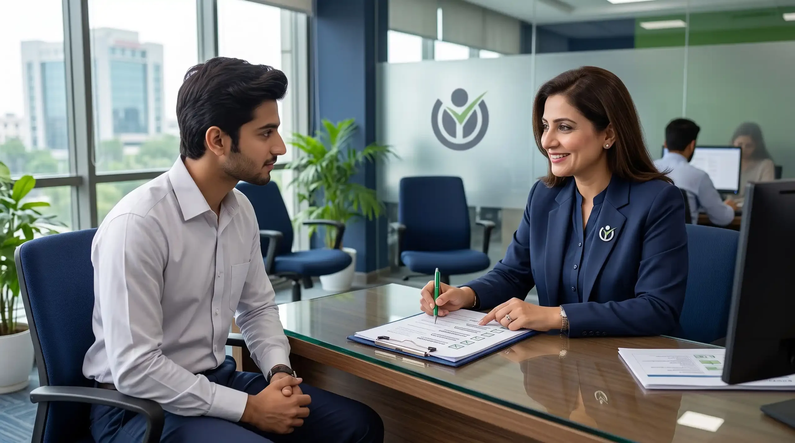 HR professional reviewing an employee onboarding checklist with a new hire