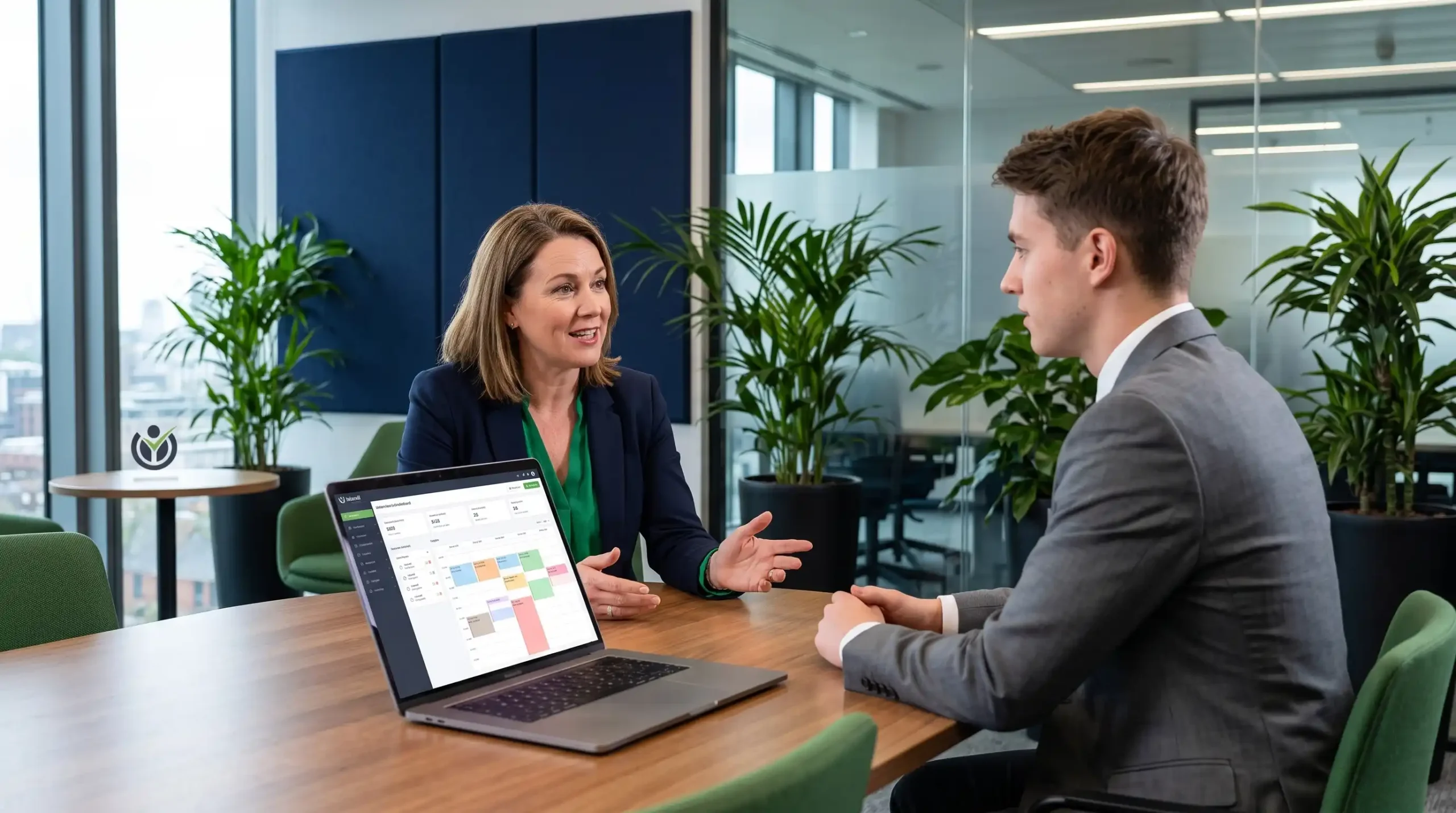 Recruiter and candidate in an interview with AI-assisted recruitment tools on screen